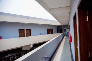 an empty hallway of a library in a building at Amani inn hotel in Kinshasa