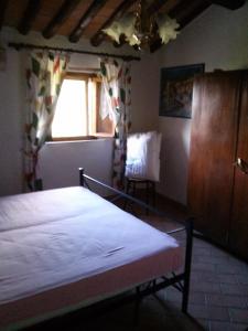 A bed or beds in a room at Appartamento Martina