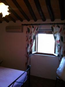 A bed or beds in a room at Appartamento Martina