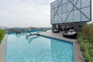a swimming pool on the roof of a building at Iconyc Charlie Ibirapuera Hotel in São Paulo