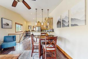 a kitchen and dining room with a table and chairs at Modern Grand Lake Luxury in Grand Lake