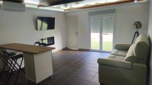 TV a/nebo společenská místnost v ubytování Optimus Studio Esturión