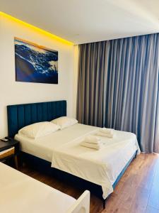 Postel nebo postele na pokoji v ubytování E&L Luxury Apartments + 12 fotografií