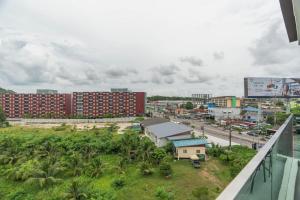 a view of a city with buildings and a street at Modern 1BR Condo w Balcony Near Central Phuket in Ban Na Khua