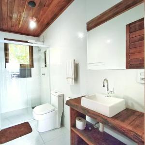 a bathroom with a sink and a toilet and a shower at Vista Linda Paraty in Paraty