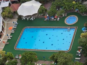 an overhead view of a swimming pool at a resort at PATONG TOWER SPACIOUS FAMILIES APARTMENT with 2 BATHROOMS 3&4 BEDROOMS Pta in Patong Beach