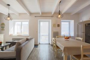 a living room with a table and a couch at Charmante maison à Pleubian in Pleubian
