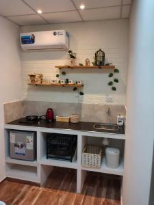 a kitchen with a counter and a sink at Refugio Urbano 2 in Corrientes