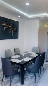 a conference room with a black table and chairs at executive 3-bedroom in Nyali
