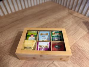 a wooden box filled with different types of food at Apartament Bergera Olive Hill-2 pokoje in Poznań