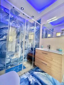 a bathroom with a glass shower with a sink at Arenaccia House Naples Center Welcome Wine in Naples