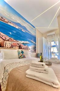 a bedroom with a large painting on the wall at Arenaccia House Naples Center Welcome Wine in Naples