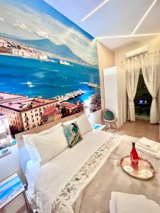 a bedroom with a view of the ocean at Arenaccia House Naples Center Welcome Wine in Naples