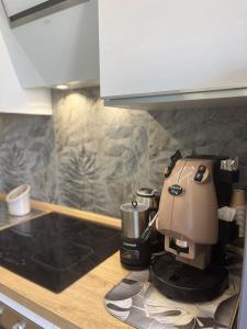a coffee maker sitting on a counter in a kitchen at Arenaccia House Naples Center Welcome Wine in Naples +34 photos