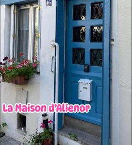 a blue door on a house with the words la maison gardenore at La Maison d'Alienor - Les Montmains - Chablis 89 in Chablis