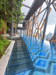 a swimming pool on the floor of a building at Scarletz Residence Near By KLCC in Kuala Lumpur