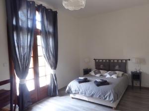 Un pat sau paturi într-o cameră la La Mimona