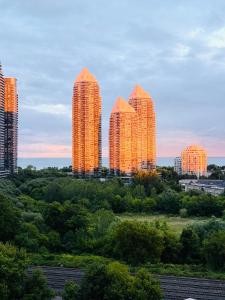 a group of tall buildings in a city at Lakeview Steps to the lake & just minutes to downtown in Toronto