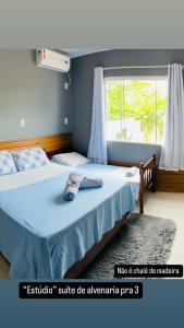 Ένα ή περισσότερα κρεβάτια σε δωμάτιο στο Hospedagem Chalés do Parque