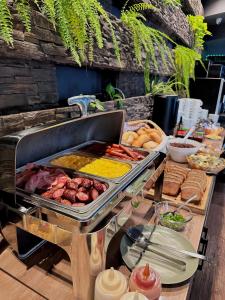 a buffet with many different types of food on a table at Płonia Economy in Szczecin