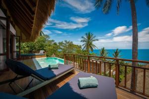 a view of the ocean from the deck of a villa at Phandara Luxury Pool Villas in Ko Tao