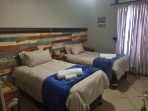 Postel nebo postele na pokoji v ubytování Skilpadvlei Cottage and Studio's