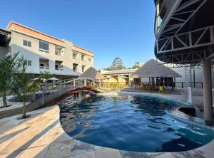 a swimming pool in the middle of a building at Ilha Bela Alter do chão - Apartment 2 suites in Santarém