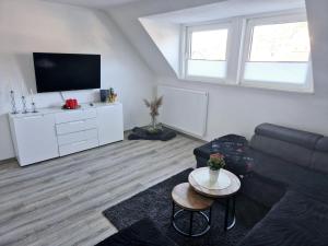 Μια τηλεόραση ή/και κέντρο ψυχαγωγίας στο Ferienwohnung in Siegen Stadtmitte
