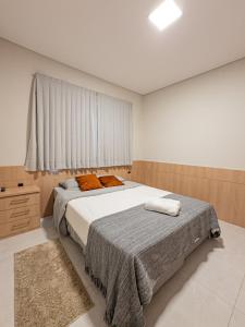 Postel nebo postele na pokoji v ubytování NOVO - Perto de tudo