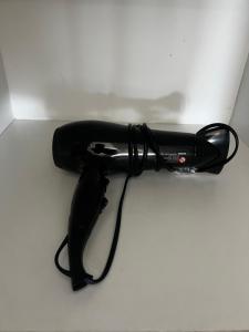 a black corded phone sitting on a table at Departamento safari 2 habitaciones 2 baños in Rancagua +6 photos