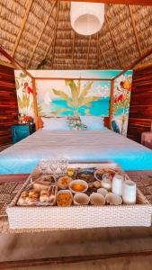 a tray of food sitting on top of a bed at Villa kite in Itarema +43 photos