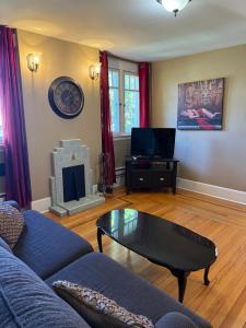 a living room with a couch and a coffee table at Midstream Manor Unit 5, 1 Bedroom Apartment in St. John's