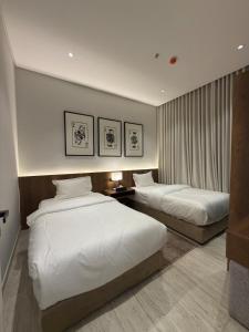 Giường trong phòng chung tại Riyadh Luxury Narjis +15 ảnh