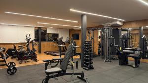 a gym with many exercise equipment in a room at Luxo na Gloria in Rio de Janeiro