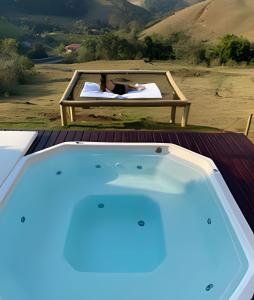 a person laying on a bed in a bed at Chalesunset in Santa Isabel