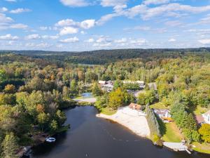 an aerial view of a river with trees and houses at Pocono's Resort - Fire Pit Jacuzzi Winter Sports Amenities in Lake Ariel