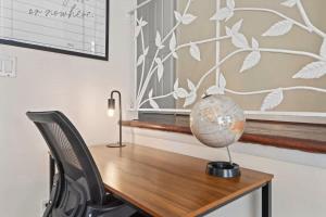 a desk with a globe on top of it at Group Chic - 25 Mins to NYC - FREE Parking - Washer & Dryer in Fairview +31 photos