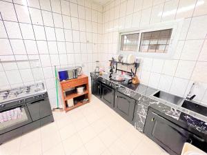a kitchen with a sink and a counter top at The Yafé Bastos 15 (Villa) in Yaoundé