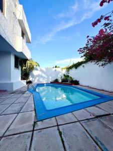a swimming pool in the middle of a yard at Incredible Loft with pool in Chuburná de Hidalgo