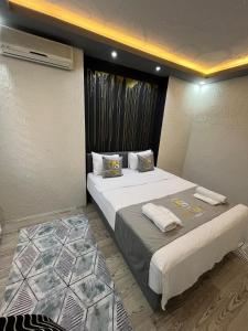 a hotel room with two beds with towels on them at Poyraz suit in Bursa