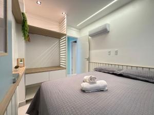 Ένα ή περισσότερα κρεβάτια σε δωμάτιο στο Apartamento Novo e Decorado com Vista Incrível +26 φωτογραφίες