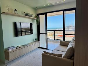 Μια τηλεόραση ή/και κέντρο ψυχαγωγίας στο Apartamento Novo e Decorado com Vista Incrível