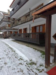 a building with snow in front of it at A stone's throw from the slopes in Gressoney in Gressoney-la-Trinité