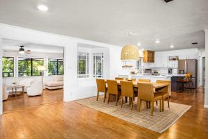 a kitchen and dining room with a table and chairs at Lake Access Pool Loungers Fire Pit Grill in McQueeney