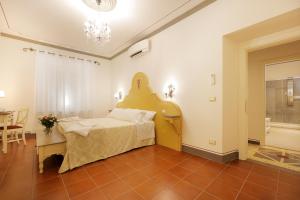 Postel nebo postele na pokoji v ubytování Palazzo Mari suite & rooms b&b