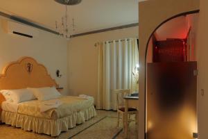 Postel nebo postele na pokoji v ubytování Palazzo Mari suite & rooms b&b