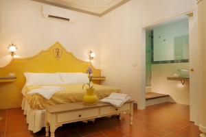 Postel nebo postele na pokoji v ubytování Palazzo Mari suite & rooms b&b