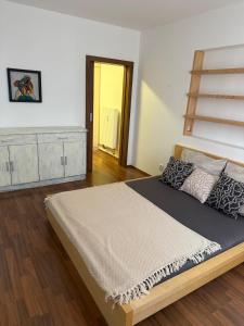 a bedroom with a large bed in a room at CosyCentrumFlat in Slezská Ostrava