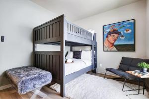 a bedroom with a bunk bed and a couch at Hanger - A Birdy Vacation Rental in San Antonio