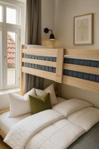 a bedroom with two bunk beds in a room at Bergen City Retreat - Steps from Bryggen - Norwegians Minimum Age 25 in Bergen +16 photos